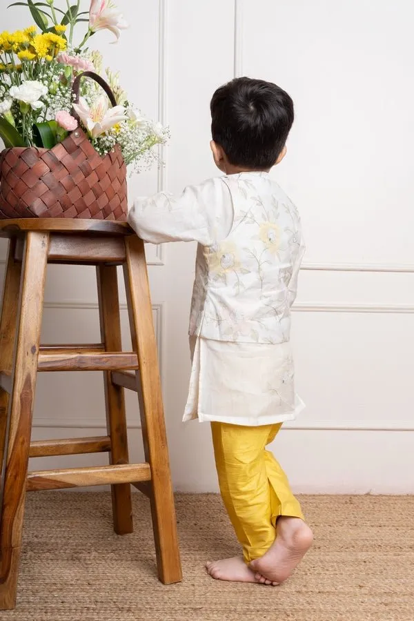 Elegant ivory kurta with matching embroidered jacket and vibrant yellow churidar pants, a stylish ensemble for festive occasions