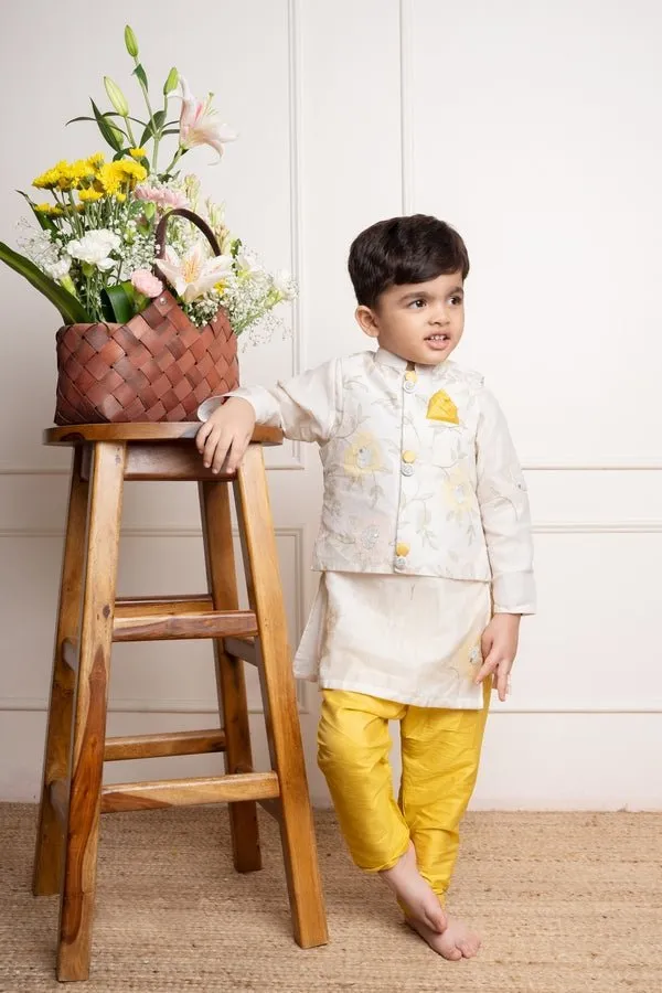 Elegant ivory kurta with matching embroidered jacket and vibrant yellow churidar pants, a stylish ensemble for festive occasions